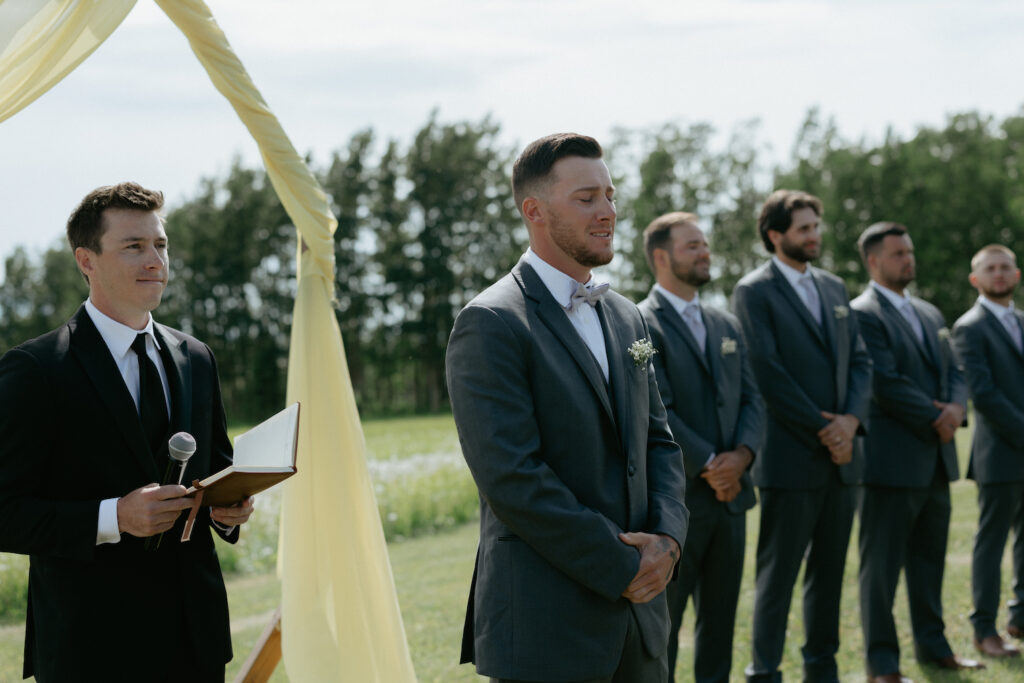 Man seeing his bride for the first time during their Alaska wedding. 