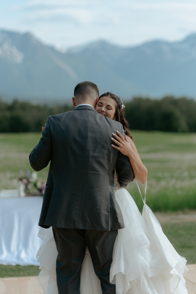 Couple sharing a first wedding dance together in Alaska.