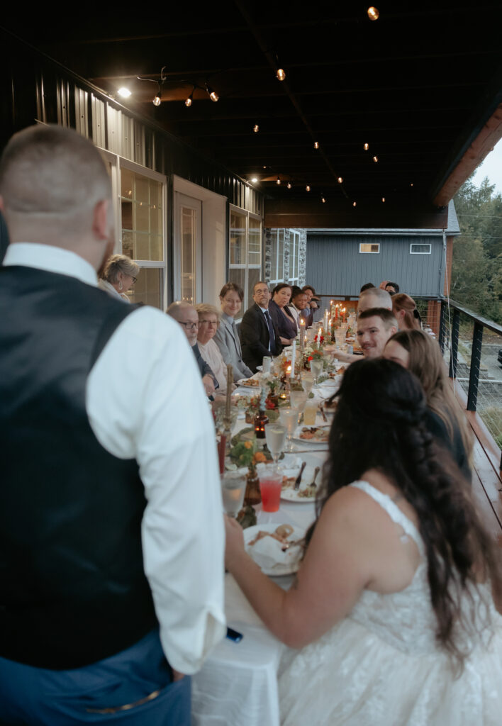 People sitting at a candlelit table 