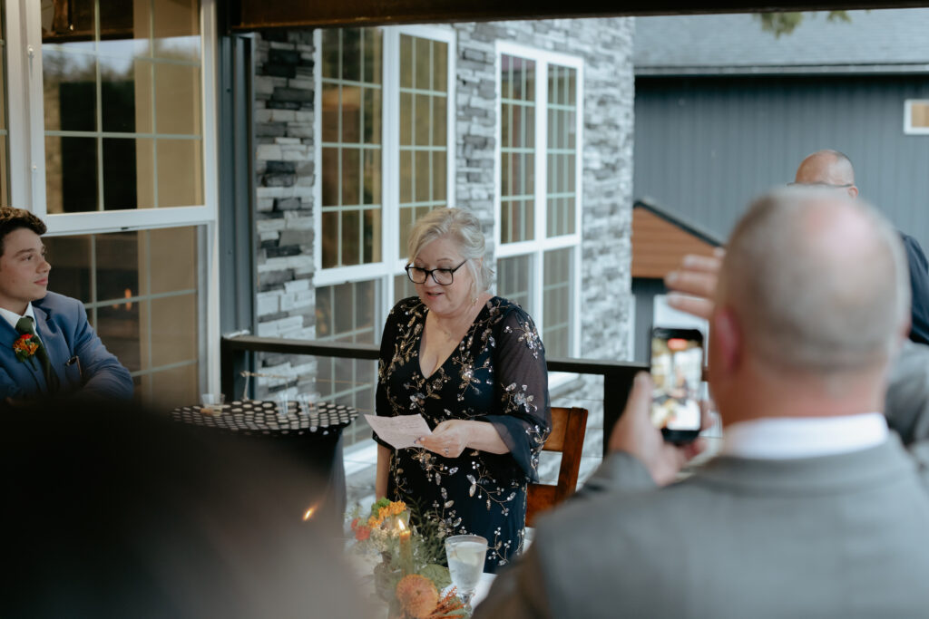 Woman holding a piece of paper and reading aloud