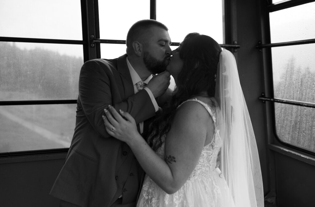 Man grabbing woman's chin and pulling her in for a kiss