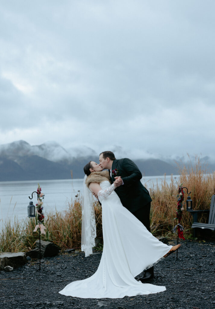 A couple kissing and dipping one another. 