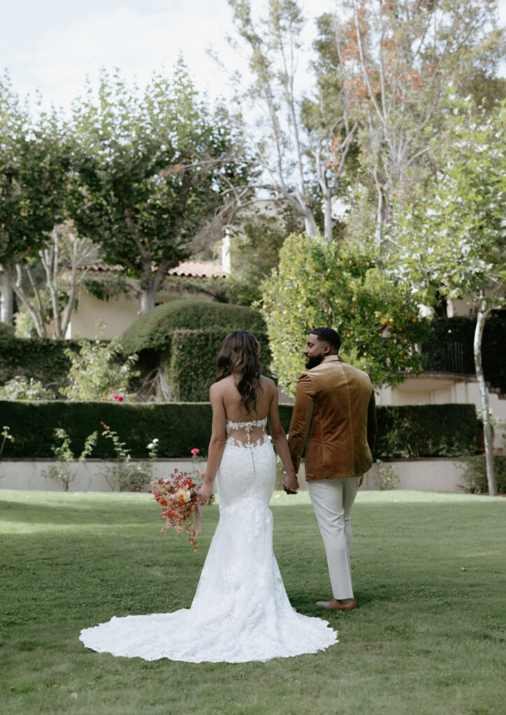 A couple walking toward a venue. 