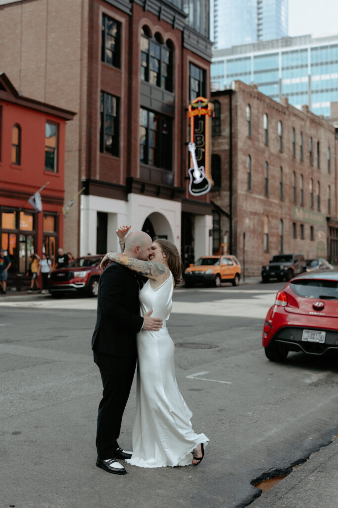 A couple embracing outside a bar in Nashville. 