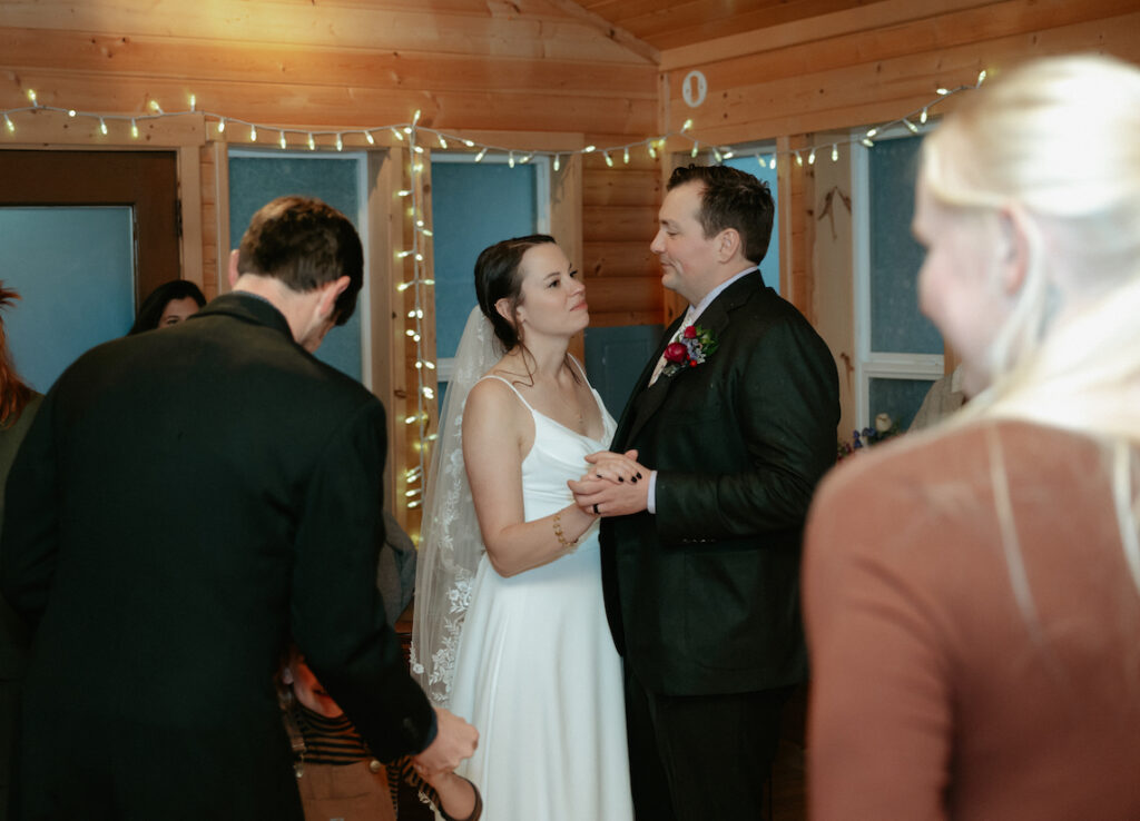 Couple holding hands and dancing with one another.