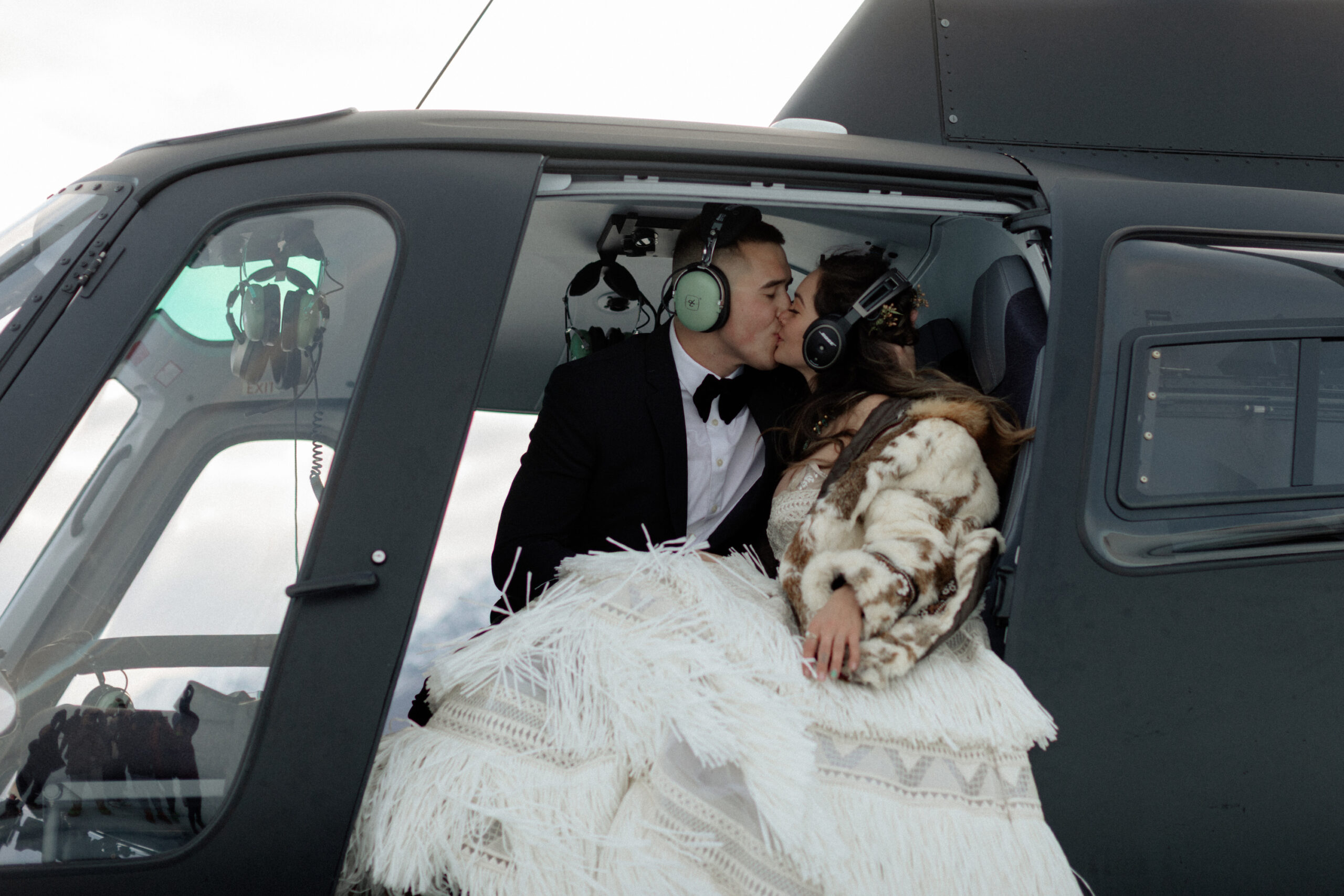 a couple in a helicopter during their glacier wedding in Alaska.