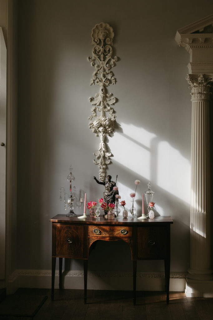 Inside the blue room a wooden table.