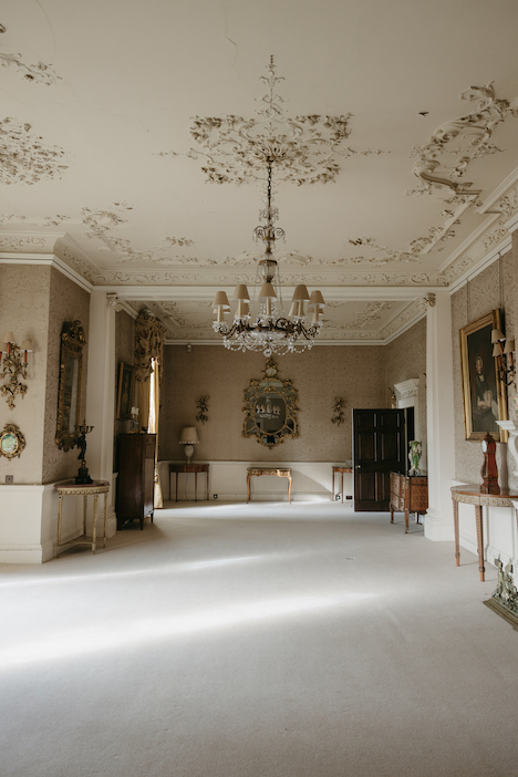 A large hall with vaulted ceilings and a stunning chandelier at Pylwell Park.