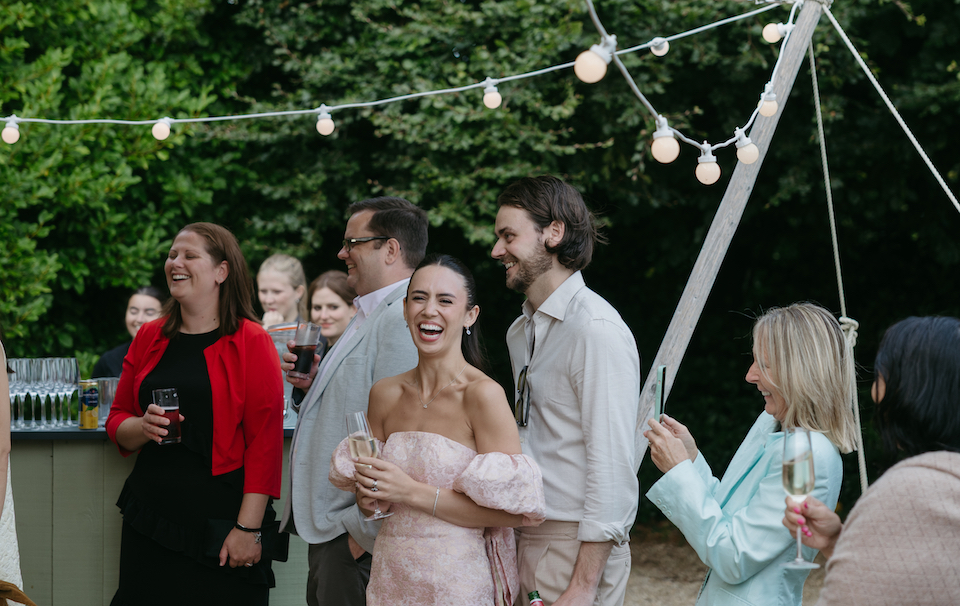 A couple standing next to one another during a speach.