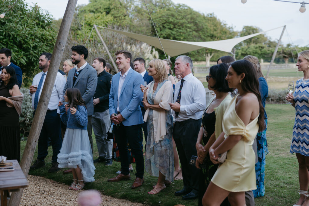A group of people gathered under a tent.