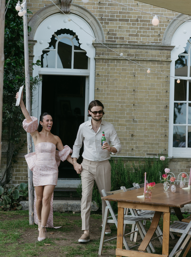 A couple wearing fun outfits for their welcome party.