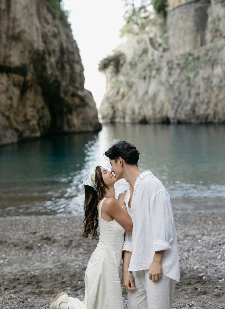 A woman holding onto a man's arm while walking